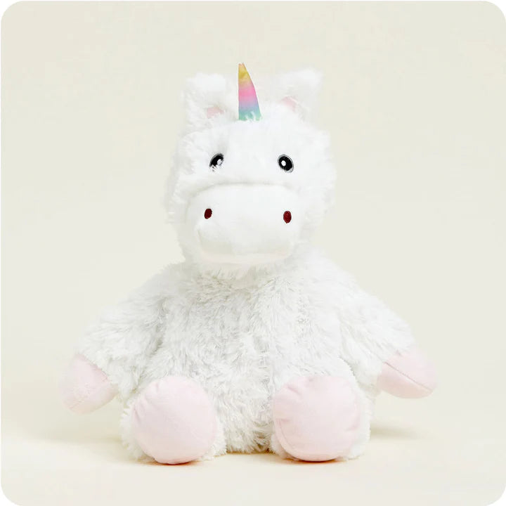 A soft, white plush unicorn toy with a rainbow mane and tail and a sparkly horn, designed to be microwavable.