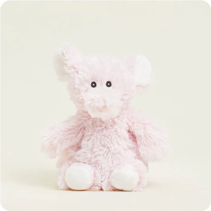 A small, soft plush pink elephant toy with large floppy ears, designed to be microwavable.