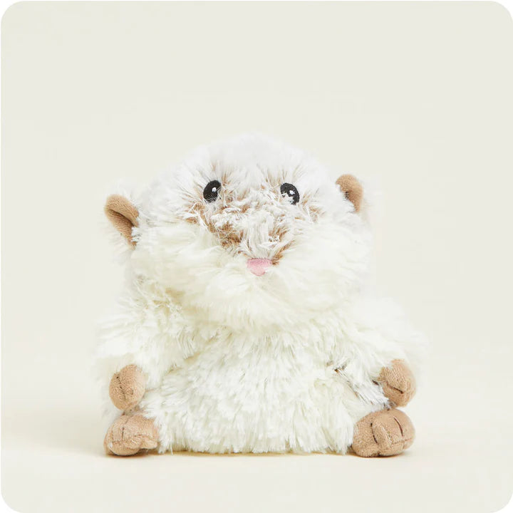 A small, soft, and round plush hamster toy with chubby cheeks, designed to be microwavable.