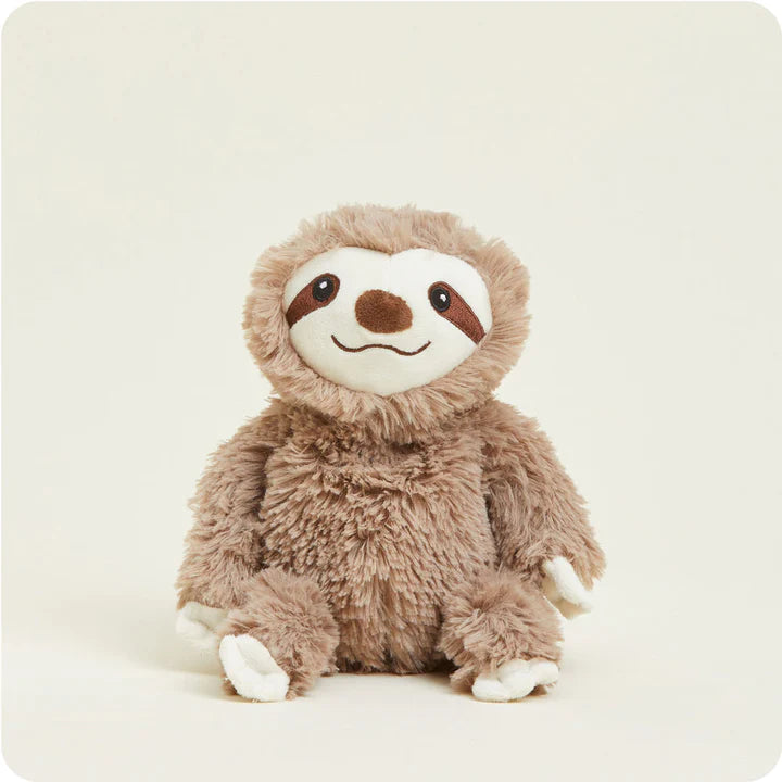 A small, soft plush sloth toy with long arms and a friendly face, designed to be microwavable.