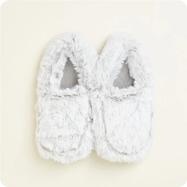 A pair of women's slip-on slippers covered in a soft, plush gray faux fur, designed to be microwavable.