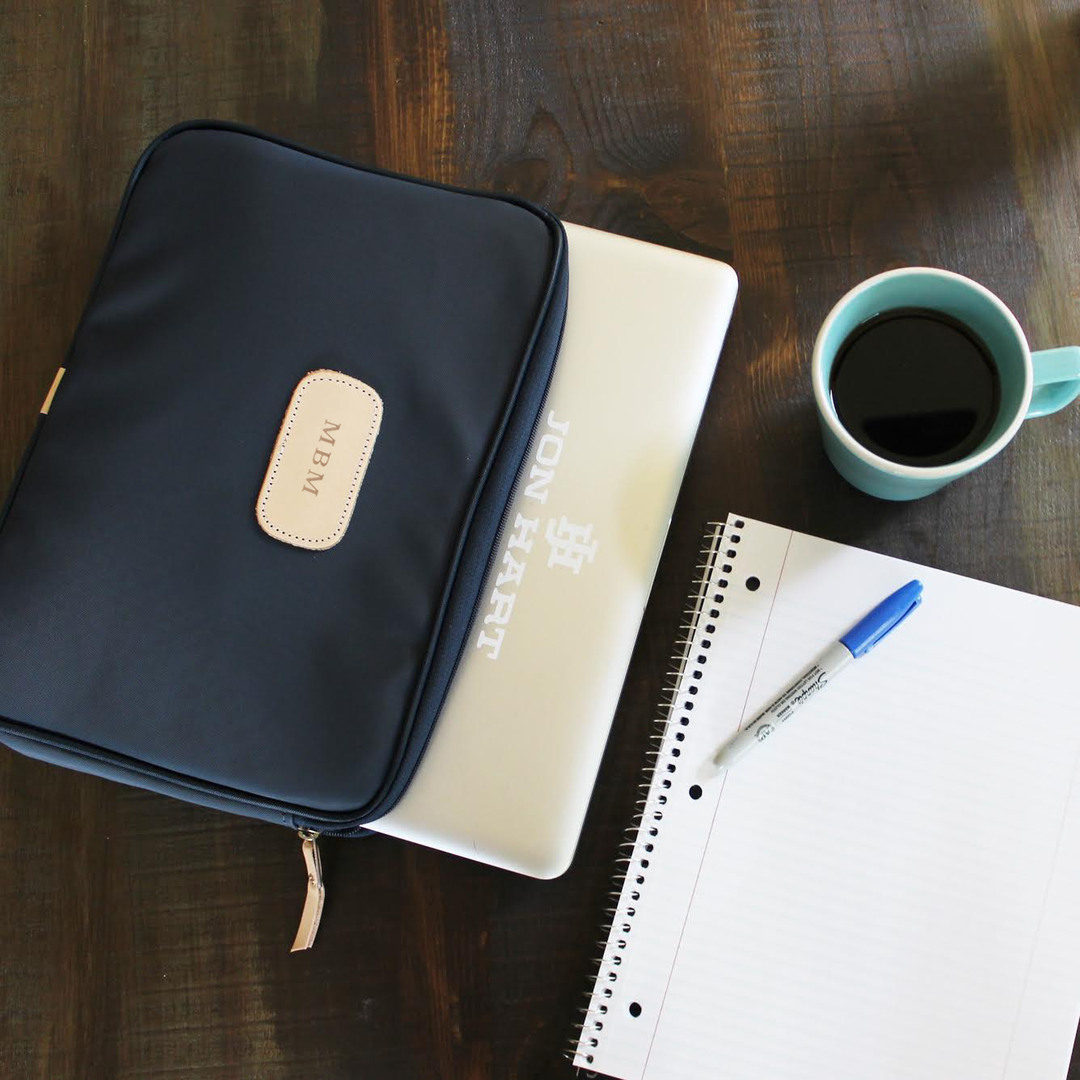 Jon Hart 13" Padded Computer Case with coated canvas, leather trim, padded interior, and zippered closure.