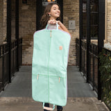 Jon Hart Two Suiter Garment Bag with coated canvas, leather details, and storage for two suits and accessories.