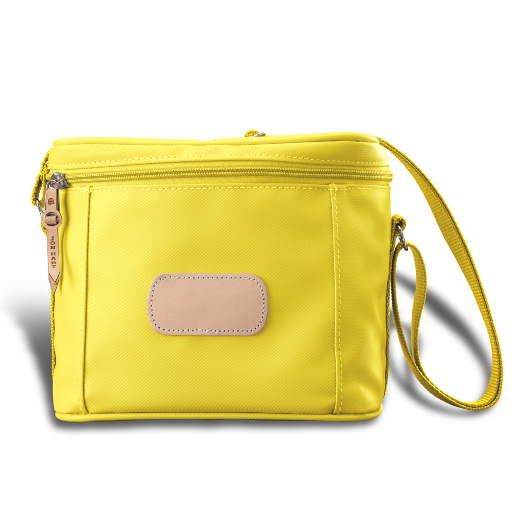 Versatile insulated Jon Hart lunch box with removable insert, zip closure, and adjustable shoulder strap in coated canvas with natural leather trim.