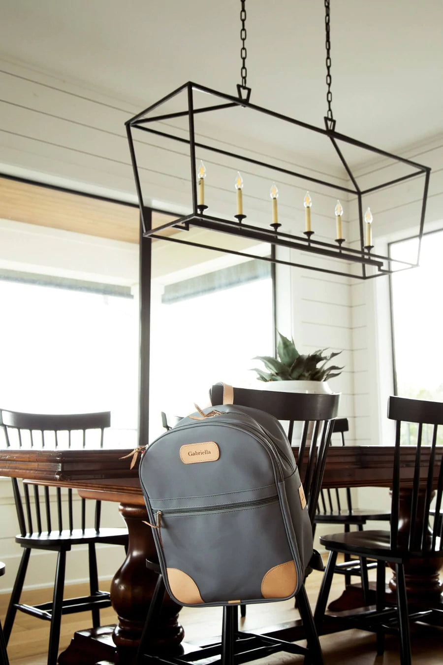 Jon Hart Large Backpack in durable coated canvas with natural leather trim, two main zip compartments, front and side pockets, adjustable leather-detailed straps, and a new trolley sleeve.