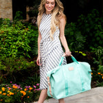 Jon Hart Weekender Bag with coated canvas, leather trim, adjustable snaps, and multiple pockets for organized travel.