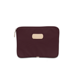 Jon Hart 13-inch padded computer case in coated canvas with natural leather trim, zippered closure, and protective padded interior — sleek sleeve for laptops up to 13 inches wide.