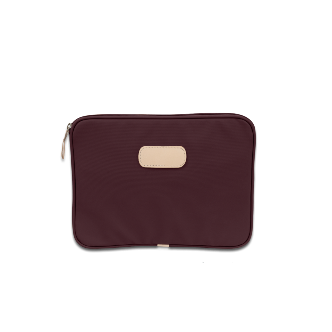 Jon Hart 13-inch padded computer case in coated canvas with natural leather trim, zippered closure, and protective padded interior — sleek sleeve for laptops up to 13 inches wide.