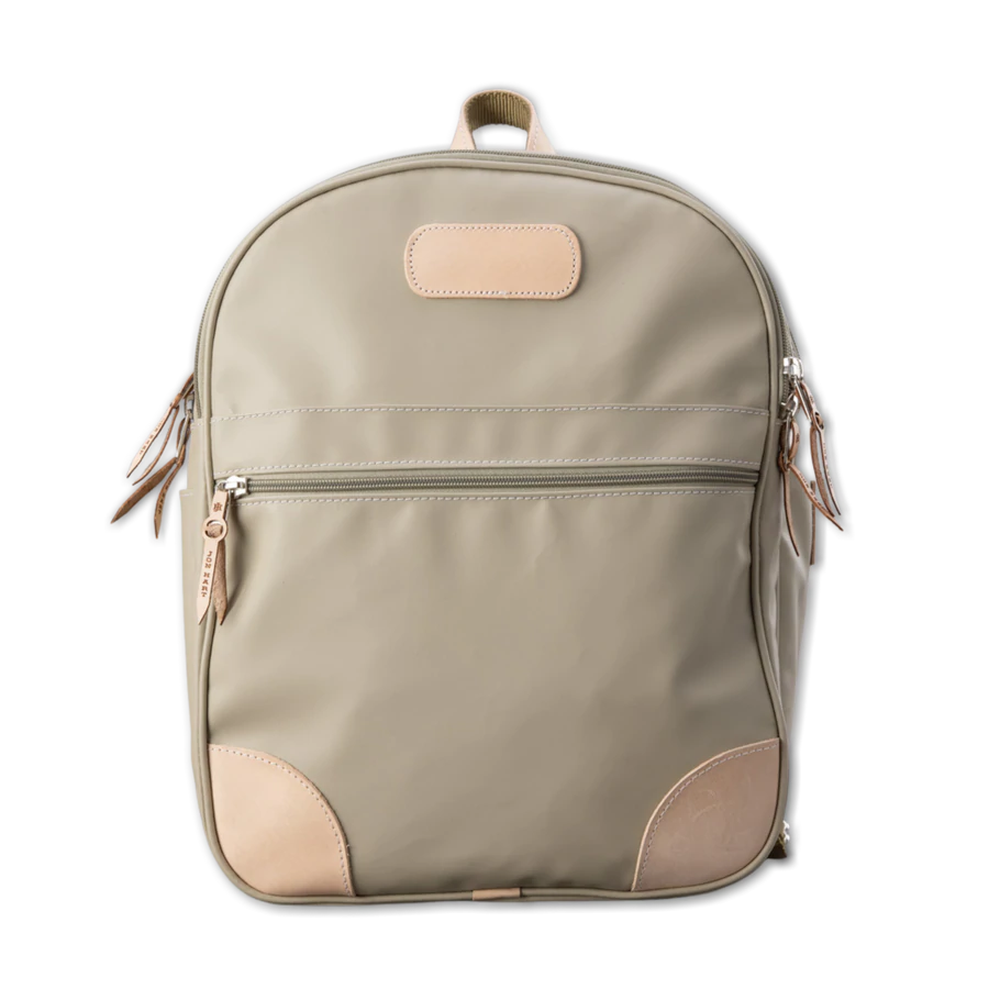 Jon Hart Large Backpack in durable coated canvas with natural leather trim, two main zip compartments, front and side pockets, adjustable leather-detailed straps, and a new trolley sleeve.