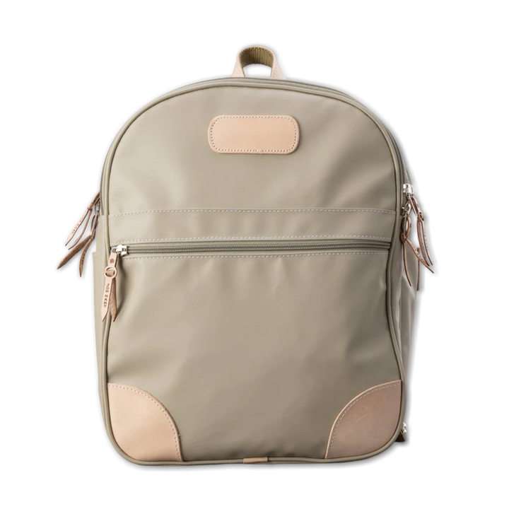 Jon Hart Large Backpack in durable coated canvas with natural leather trim, two main zip compartments, front and side pockets, adjustable leather-detailed straps, and a new trolley sleeve.