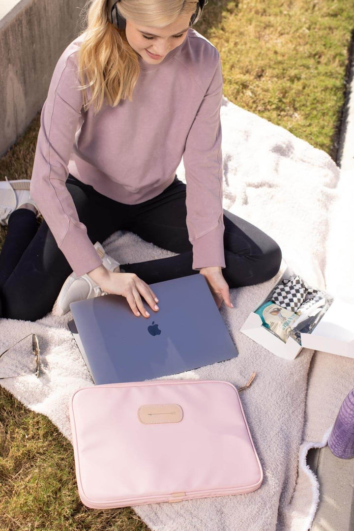 Jon Hart 15-inch padded computer case in coated canvas with natural leather trim, soft protective interior, and full zip closure — designed for laptops up to 15 inches wide.
