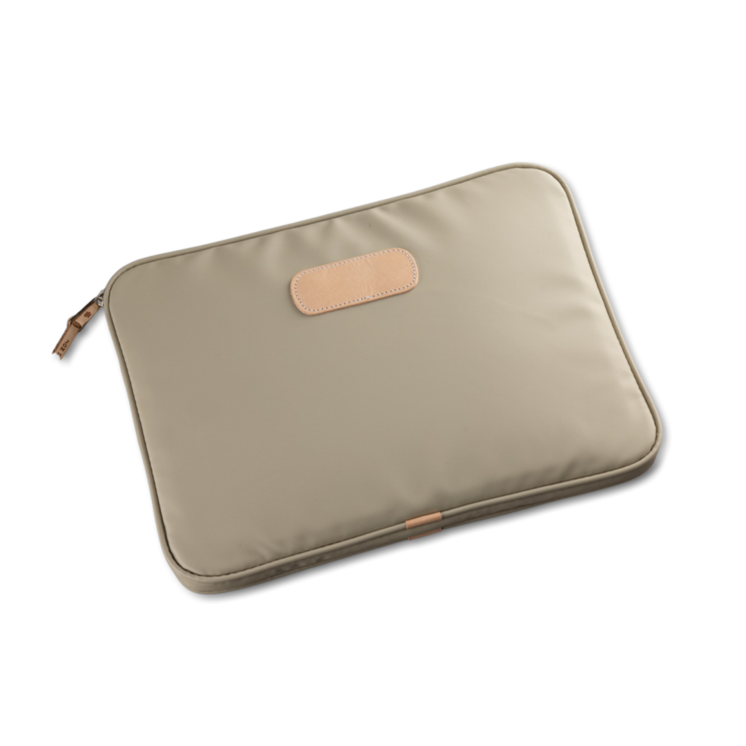 Jon Hart 15-inch padded computer case in coated canvas with natural leather trim, soft protective interior, and full zip closure — designed for laptops up to 15 inches wide.