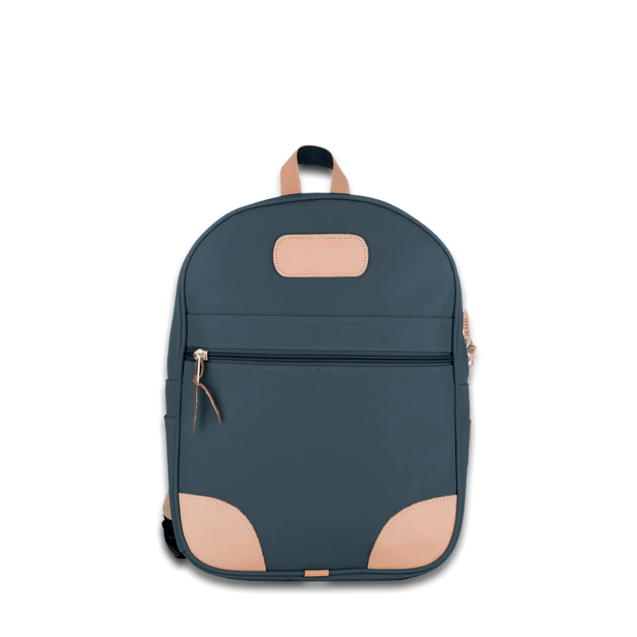 Jon Hart french blue coated canvas backpack with Natural Leather trim, front zip pocket, two side pockets, and adjustable leather-detailed straps.